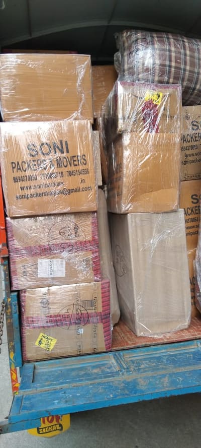 Soni Packers branded cartons loaded and stacked on a goods vehicle
